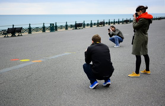 Brighton On Photography students taking photographs on the Brighton seafront.